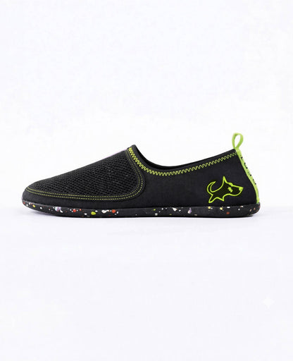 Black slip-on lightweight shoe with neon green stitching and speckled sole, side view