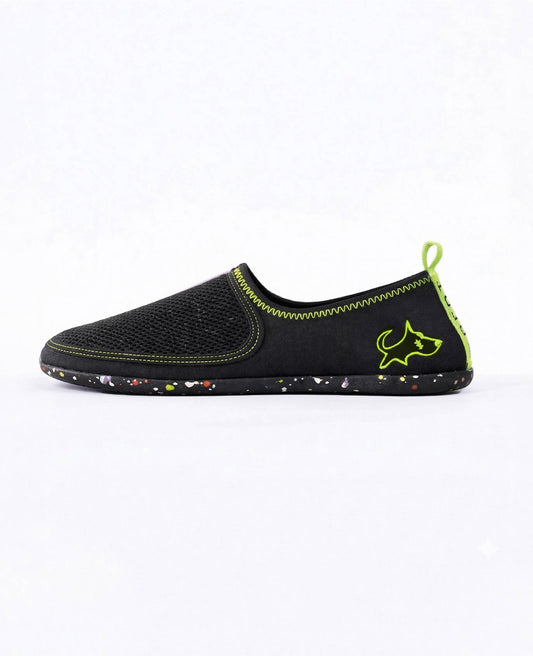 Black slip-on lightweight shoe with neon green stitching and speckled sole, side view
