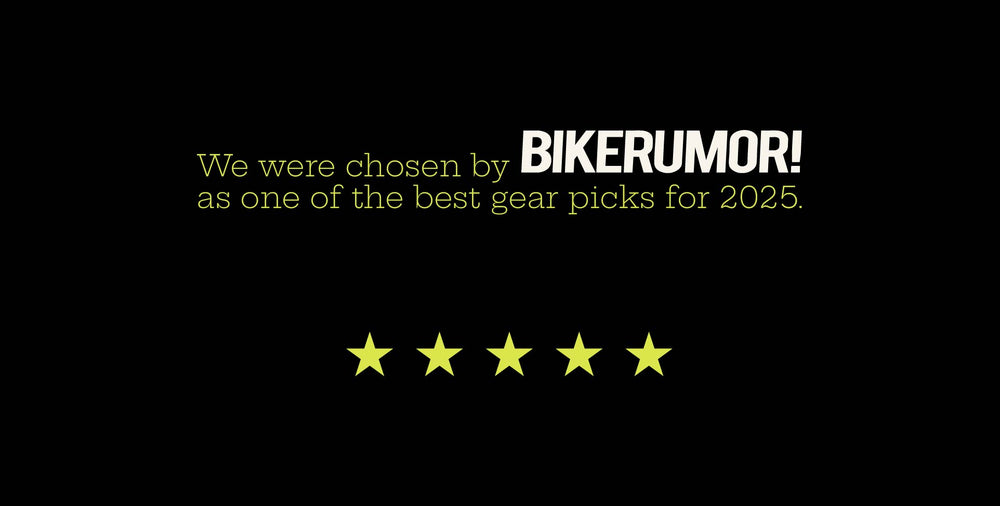 Text graphic reading 'We were chosen by Bikerumor as one of the best gear picks for 2025' with five yellow stars on a black background.