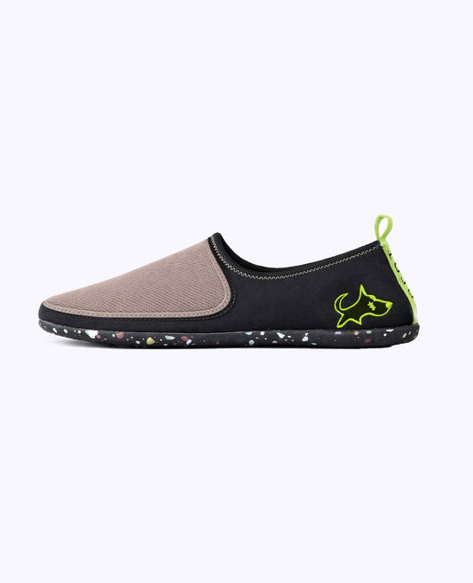 Lightweight slip-on shoe with mocha brown mesh toe, black side, neon green dog logo, and speckled sole
