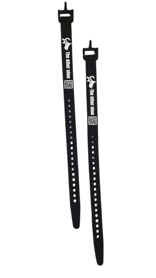 Two black adjustable silicone straps with holes, buckles, and 'The other shoe' text, shown on white background.